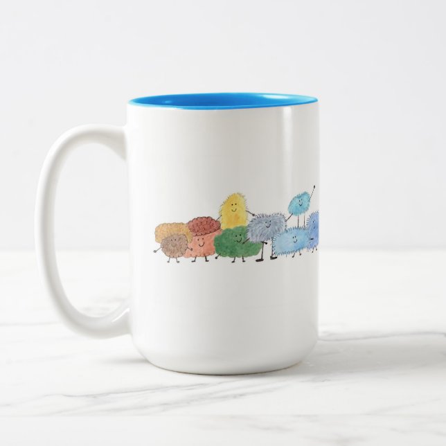 Cute Fluffy Creatures on a Coffee Mug (Left)