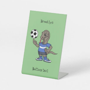 Cute funny Komodo dragon playing soccer cartoon Pedestal Sign