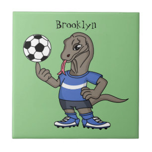 Cute funny Komodo dragon playing soccer cartoon Tile