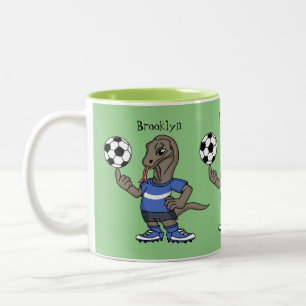 Cute funny Komodo dragon playing soccer cartoon Two-Tone Coffee Mug