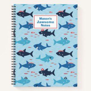 Cute funny sharks with pirate hats on blue notebook