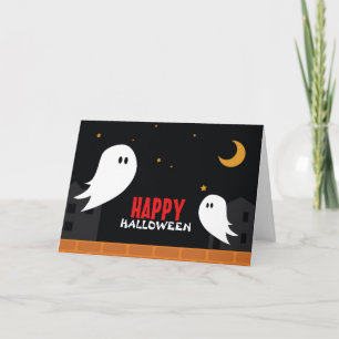 Cute ghost wandering in town halloween night holiday card
