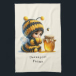 Cute Girl in Bee Costume with Honey Kitchen Towel<br><div class="desc">A kitchen towel with a cute image. A girl in a crocheted bee costume with a bee by her side. Watching over a jar of honey.</div>