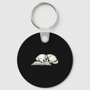 Cute golden retriever dog sleeping on book reader keychain