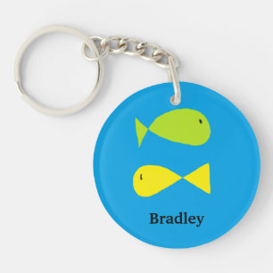 Cute green and yellow fishes on blue keychain