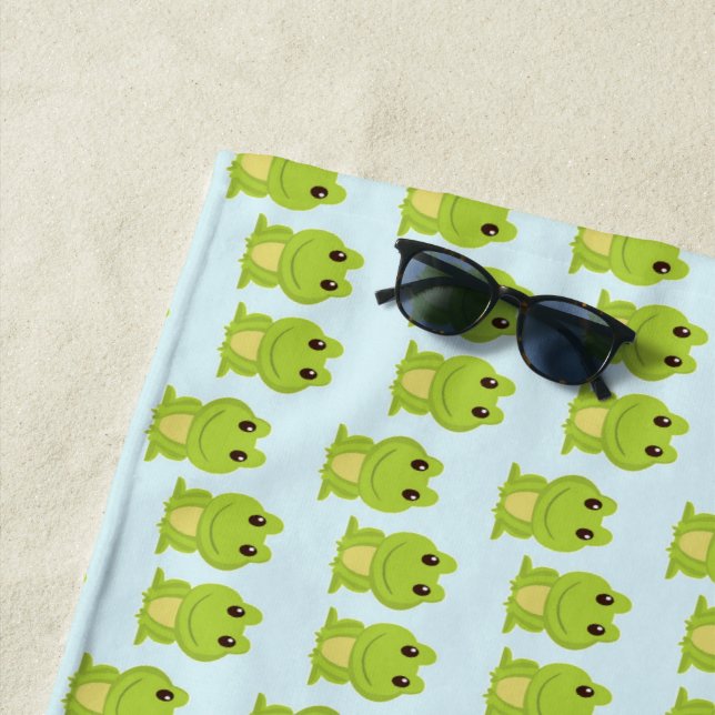 Cute green frogs on blue beach towel (In Situ)