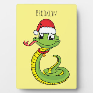 Cute green snake with santa hat cartoon plaque