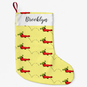 Cute grenouille dans une chaussette rouge saut de
