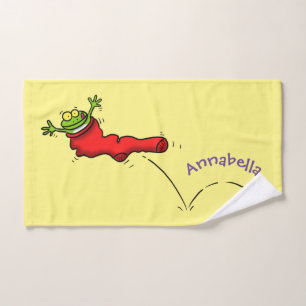 Cute grenouille dans une chaussette rouge saut de