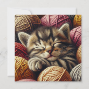 Cute Grey Kitten Napping in Balls of Yarn