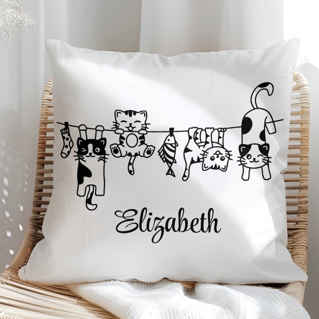 Cute Hanging Kittens Custom Name Throw Pillow (Cute Hanging Kittens Custom Name Throw Pillow in a sunny rattan armchair.)