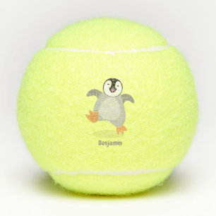 Cute happy emperor penguin chick cartoon  tennis balls
