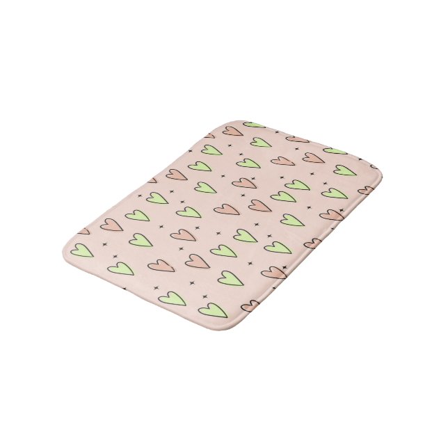Cute hearts and stars pattern on pink bath mat (Angled)