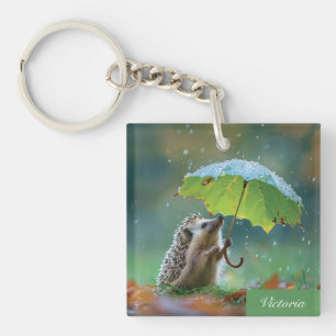 Cute hedgehog holding a leaf umbrella keychain
