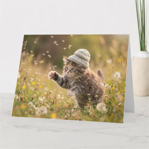 Cute Kitten Wearing a Hat Playing with Dandelions Card