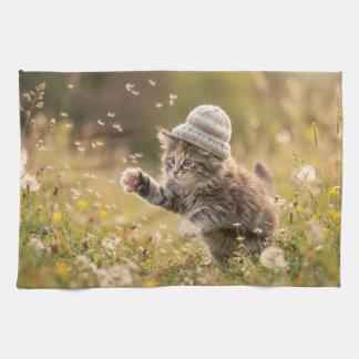 Cute Kitten Wearing a Hat Playing with Dandelions Kitchen Towel