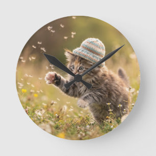 Cute Kitten Wearing a Hat Playing with Dandelions Round Clock