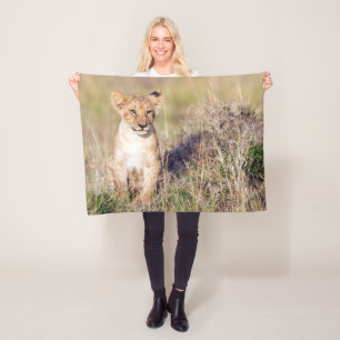 Cute lion cub in Africa photo Fleece Blanket