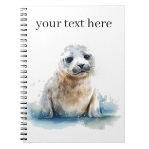 Cute little baby seal in white and blue notebook