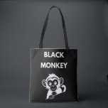 Cute Little Black Monkey Tote Bag<br><div class="desc">Meet your new favorite jungle friend! This adorable peeking monkey design features a clean,  white illustration that pops perfectly on dark fabrics. A fun and playful choice for kids,  wildlife enthusiasts,  or anyone who loves a bit of monkey business.</div>