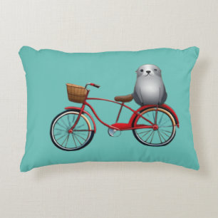 Cute little cartoon seal on a bicycle accent pillow