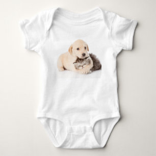 cute little cat sleeps in dog's hands baby bodysuit