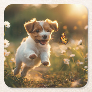 Cute little puppy chasing after a butterfly square paper coaster