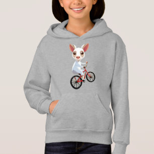 Cute little white goat on a bicycle