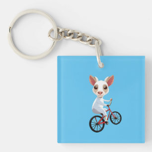 Cute little white goat on a bicycle keychain