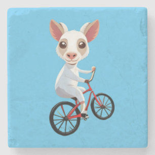 Cute little white goat on a bicycle stone coaster