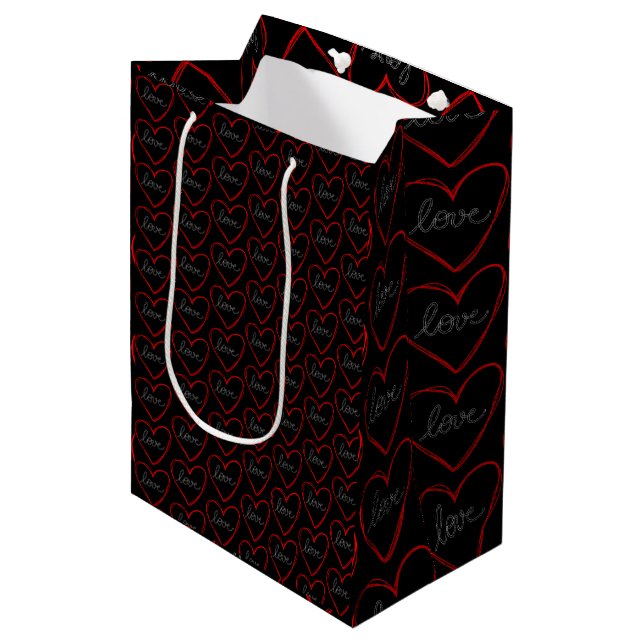 Cute love heart pattern on black medium gift bag (Front Angled)