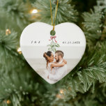 Cute Mistletoe Newlyweds Wedding Photo Monogram Ceramic Ornament<br><div class="desc">Cherish your first Christmas together with our watercolor Mistletoe Newlyweds ornament. Customized for the newlyweds' joyous memories with your favourite wedding photo as well as a cute watercolor mistletoe illustration,  your names and monogram,  and date of nuptials.🎄📸✨ #FirstChristmasJoy #PersonalizedKeepsake</div>