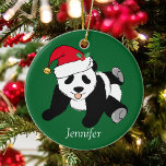 Cute Panda Bear Kids Monogram Christmas Ceramic Ornament<br><div class="desc">This pretty panda bear Santa Claus Christmas ornament is a beautiful animal holiday gift for a child who loves panda bears. I like wild animals and a Christmas panda bear takes the cake wearing a red Santa hat! Personalize this green gift with a name.</div>
