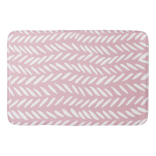 Cute pastel herringbone pattern on pink square bath mat