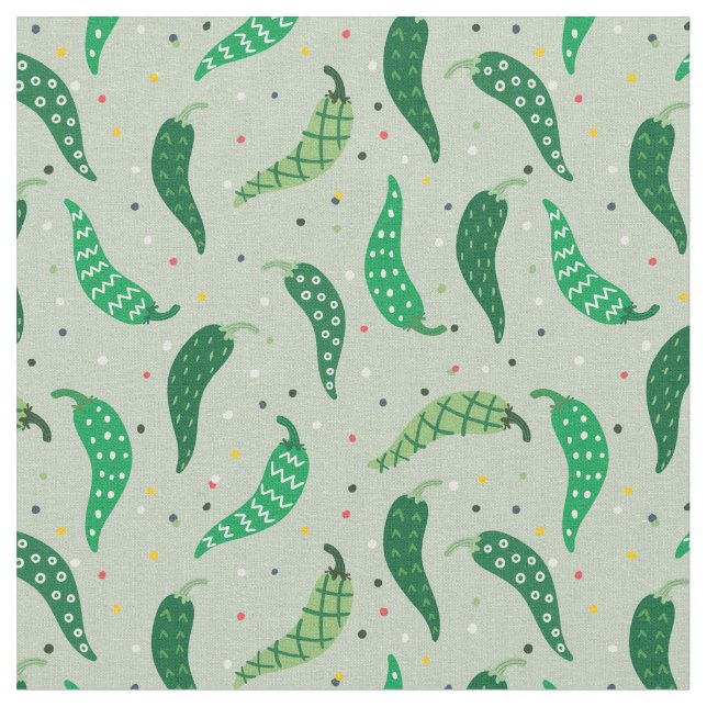 Cute Patterned Chile Peppers on Green Fabric (Close Up)