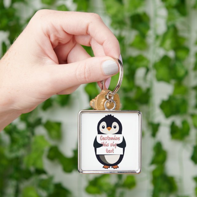 Cute penguin holding a sign for personalized text keychain (Hand)