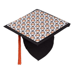 Cute penguin holding sign with the number 99 on it graduation cap topper