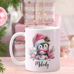 Cute Penguin Script Name Pink Christmas Coffee Mug<br><div class="desc">Create a unique personalized Christmas mug that features a cute penguin in a pink Santa hat and scarf, surrounded with festive greenery and ornaments. The girly pink design of the cheerful penguin with a snowman, and name template in a calligraphy script font makes it easy to create a perfect coffee...</div>