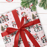 Cute Penguins in Red Hats Fun Pink Christmas Wrapping Paper<br><div class="desc">This pink Christmas wrapping paper features a fun pattern of penguins in red Santa hats celebrating the winter holidays. Cheerful penguins decorate Christmas trees,  meet family and friends,  and ice skates,  so this design is perfect for festive gift wraps. This pattern is on a solid pink pastel background.</div>