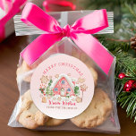 Cute Pink Candy Gingerbread House Merry Christmas Classic Round Sticker<br><div class="desc">Add a sweet, festive touch to your holiday gifts with our Cute Pink Candy Gingerbread House Merry Christmas Label, featuring a charming gingerbread house, a festive cookie, and the cheerful quote “Merry Christmas & Warm Wishes.” This label can be personalized with a name, making it a delightful way to send...</div>