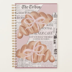 Cute ,pink ,girly planner with croissants .