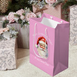 Cute Pink Santa Claus Personalized Girls Christmas Medium Gift Bag<br><div class="desc">Customize this pretty pink from Santa Claus blue gift bag with your own personalized text with your little girl's name in white script. This beautiful old fashioned drawing of Santa's red hat and white beard are the perfect holiday present bags for your children's presents under the tree on Christmas day....</div>