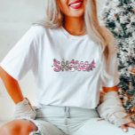 Cute Pink SNOW Women's  T-Shirt<br><div class="desc">Pink holiday t-shirt, cute snow shirt, festive winter apparel, women’s Christmas tee, snowman graphic shirt. Show off your love for winter in a chic way! This pink-themed "SNOW" shirt brings a playful mix of patterns with a snowman and tree, making it an irresistibly cute addition to your holiday outfit collection....</div>