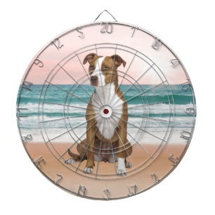 Cute Pitbull Dog Sitting on Beach with sunset Dartboard