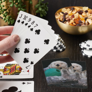 Cute Playful Sea Otters Playing Cards