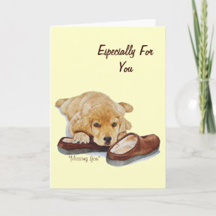 cute puppy golden retriever dog cuddling slippers card