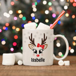 Cute Reindeer Girl Red Bow Custom Name Christmas Coffee Mug<br><div class="desc">Cute and girly Christmas coffee or hot cocoa mug features an illustration of a sweet Rudolph reindeer girl face with a shiny red nose, eyelashes, and antlers. She is dressed up with a red bow and surrounded by light grey snowflakes. Personalize this festive hot chocolate mug with a first name...</div>