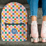 Cute Retro Chequerboard Monogram Vintage Colours Printed Backpack<br><div class="desc">This fun, stylish custom backpack features a chequerboard pattern in retro / vintage shades of bright tangerine orange, blue, kelly green, yellow, pink, and cream. A monogram initial text template is included - use it to personalize your backpack or remove it and the circle, if you'd prefer no monogram. This...</div>