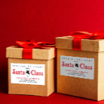 Cute Retro Red Santa Claus Desk Christmas Delivery Sticker<br><div class="desc">Take your holiday greetings back in time with our Vintage Red and White Script Sticker! Inspired by the iconic lettering from Santa Claus's workshop, this label adds nostalgic charm to your Christmas mailings. Set against a crisp white background, the customizable text makes each label uniquely yours. Perfect for sealing envelopes,...</div>