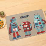 Cute Retro Robots Personalized Sci-Fi Laminated Place Mat<br><div class="desc">Add a sci-fi touch to your table with this placemat. It features cute retro style illustrations of robots in shades of red and blue against a tan coloured background. The front of the place mat has a spot at the top to add a name. The reverse side has a coordinating...</div>